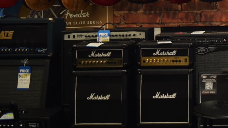 Guitar amplifiers stacked on the floor