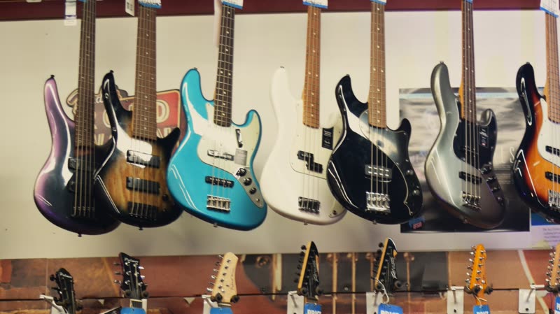 A row of bass guitars