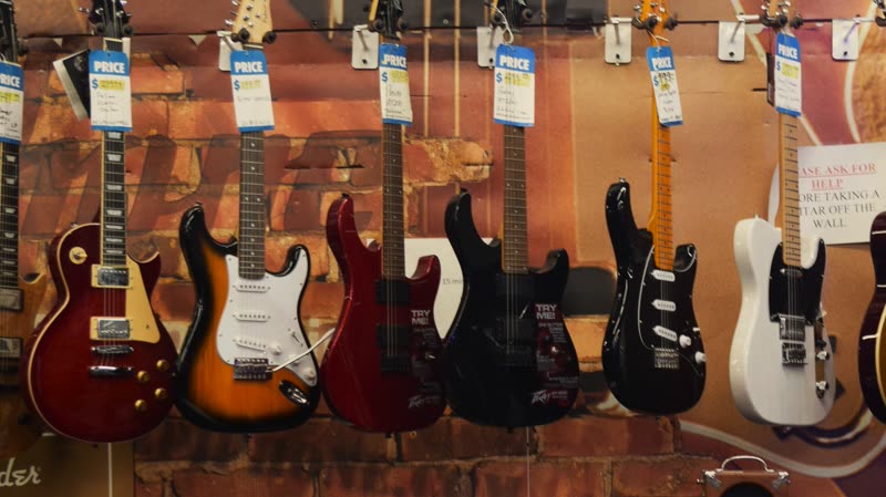 A wall of electric guitars at Musicians Discount Center